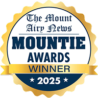 badge in gold that says The Mount Airy News Mountie Awards Winner 2025